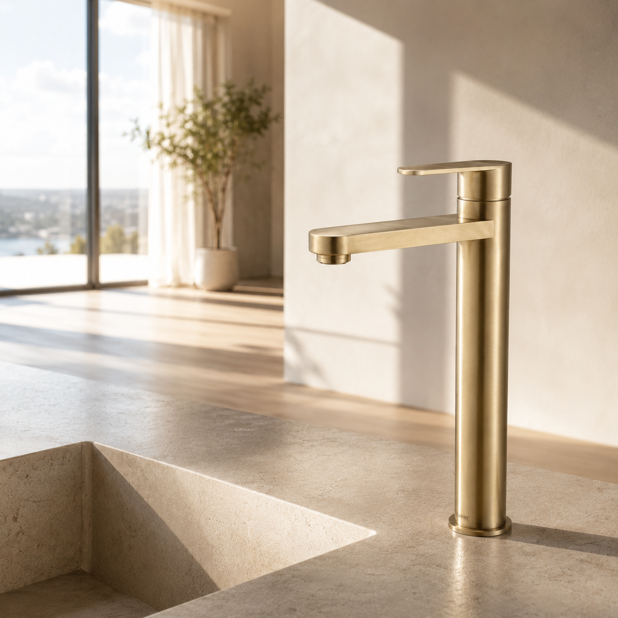 Modern brushed brass basin mixer in a high-end penthouse bathroom with neutral tones, soft shadows, and minimalist interior styling.