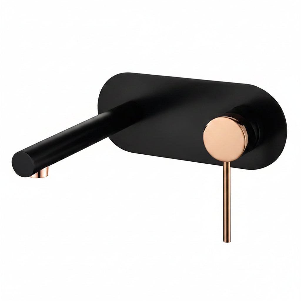 Luxury matte black and rose gold wall-mounted basin mixer in a modern designer bathroom with warm ambient lighting